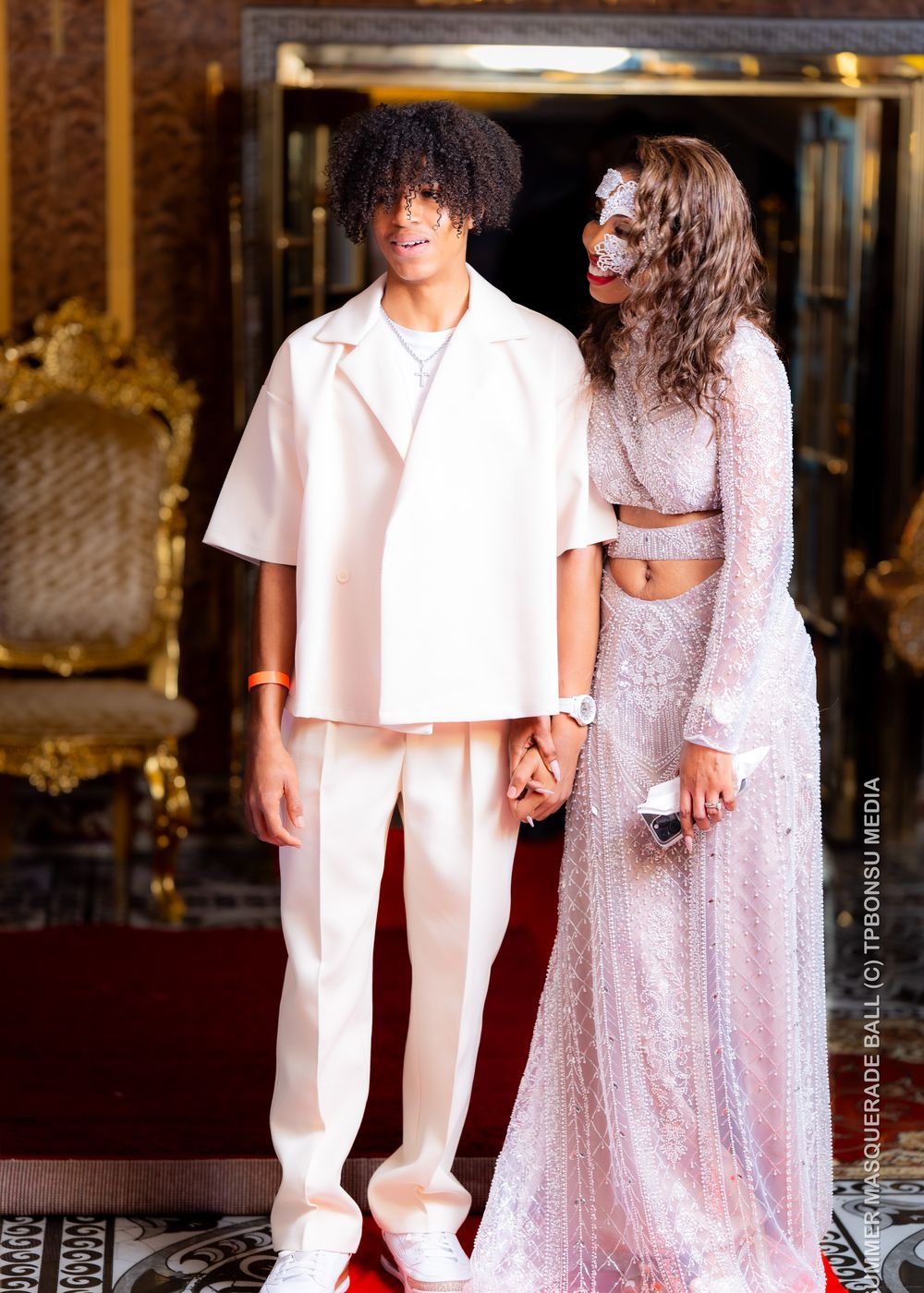 Guests arriving on the red carpet in formalwear